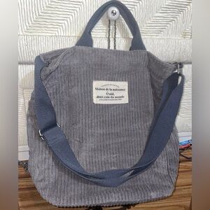 Lightweight gray corduroy tote. Very cute and roomy. Great for books!